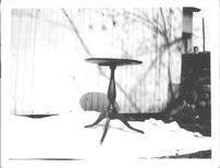 SA0622 - Photo of a candle stand--round top and three legs--possibly from the Groveland, NY Shaker community. Identified on the back., Winterthur Shaker Photograph and Post Card Collection 1851 to 1921c